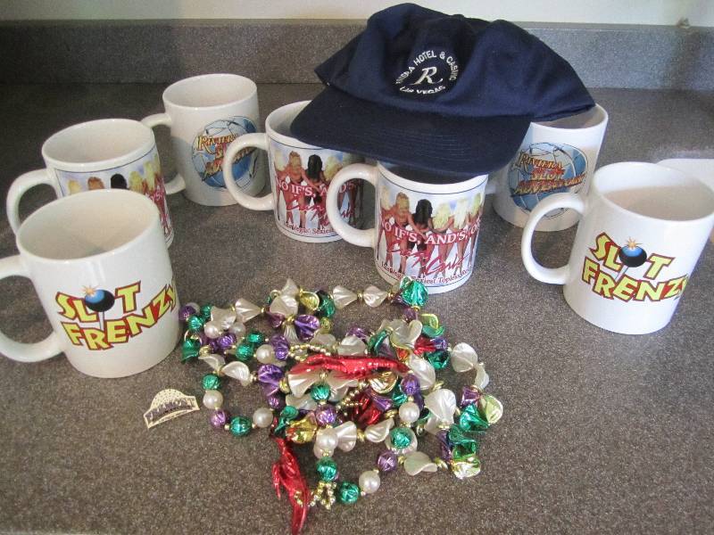 Lot of Las Vegas mugs, cap and bead...
