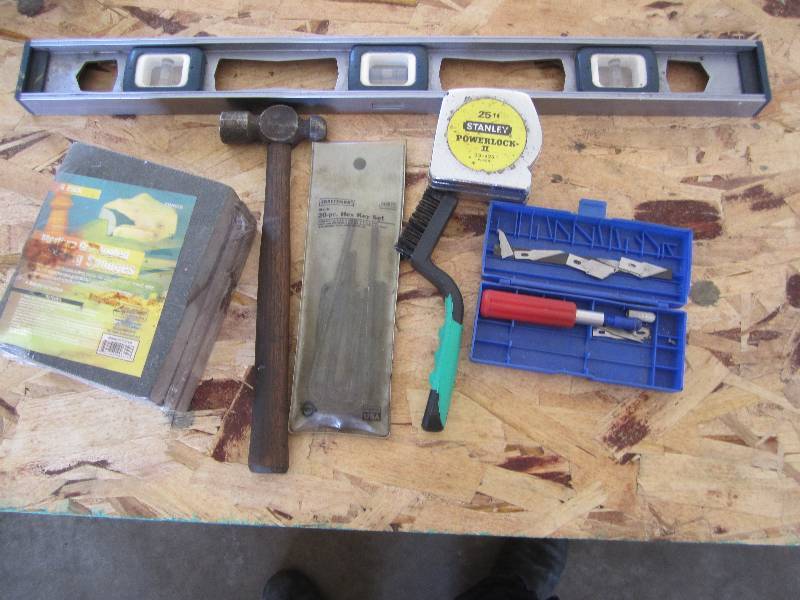 Lot of hand tools and sanding spong...