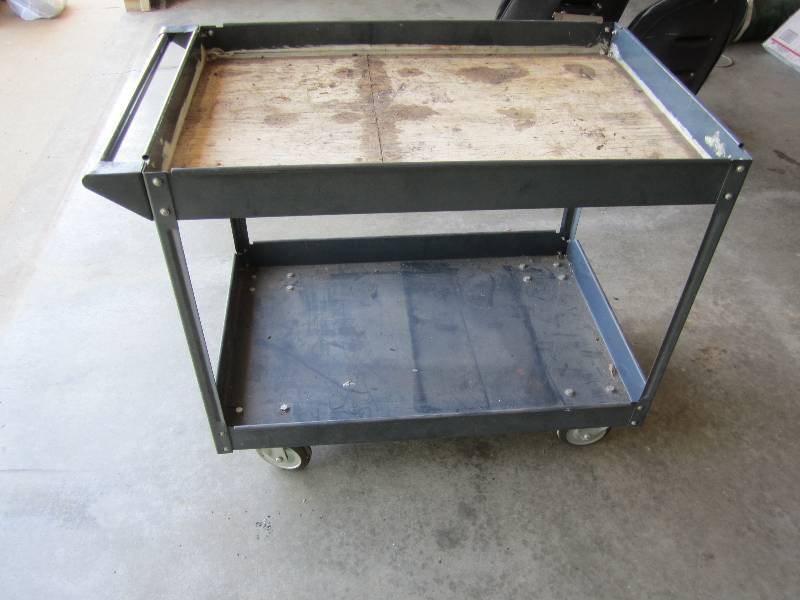 Sturdy metal cart on caster wheels,...