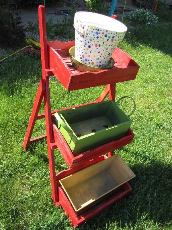 Red wooden display stand...