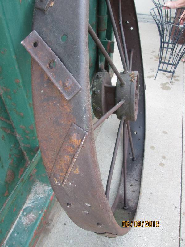 Antique John Deere metal tractor wheel, 44 across