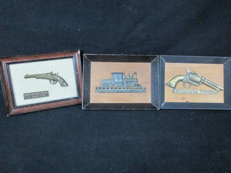 lot 136 image: 3 Brass Gun & train Wall Plaques