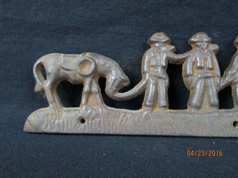 lot 38 image: Cast Iron Cowboys & Horses Wall Art