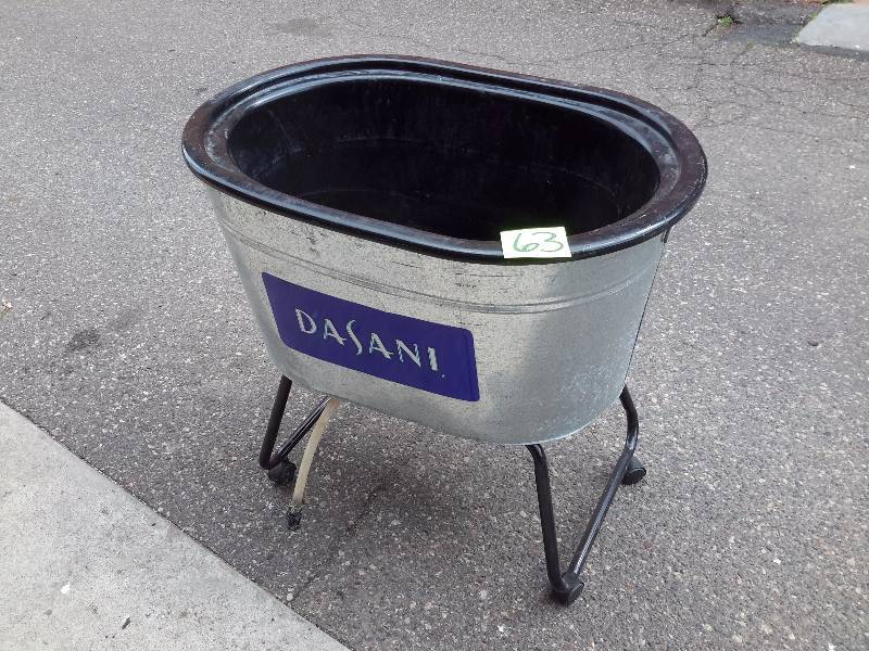 lot 63 image: DASANI Galvanized, plastic lined Insulated bin.  37in x 25in x 18 in d  Has drain hose. On Wheels