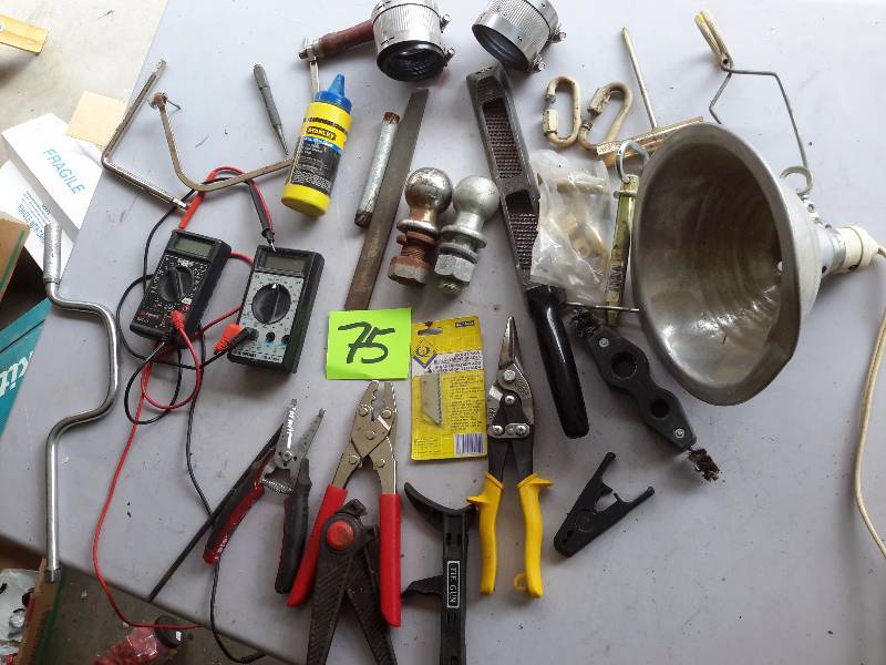 lot 75 image: Misc. items as pictured Including 2 trailer balls, 1 78 and 2 in 2 Volt meters, clippers and other as pictured.
