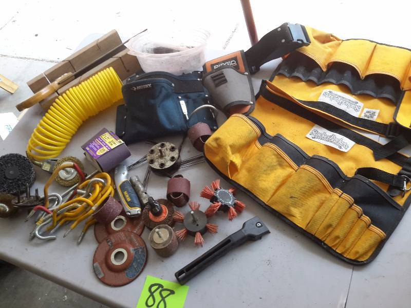 lot 88 image: Misc. items.. Including  grinding and cleaning drill attachments  coil air hose, mitre saw, 2 canvas tool belts.