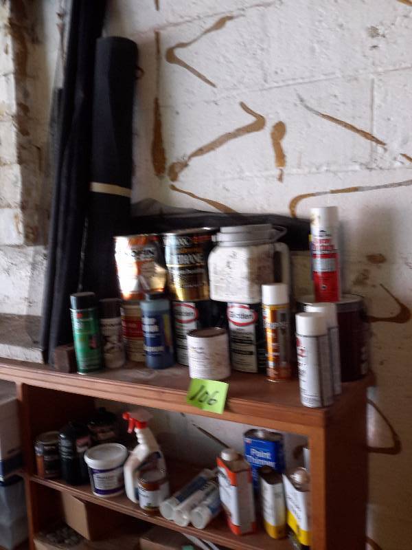 lot 106 image: Misc. Paints, thinners, etc.. See close up pictures. It seems all this paint is good.  Bring your own box to pack