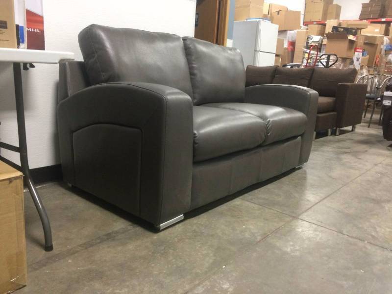 lot 8 image: Brand New Gray Bonded LeatherMatch Loveseat