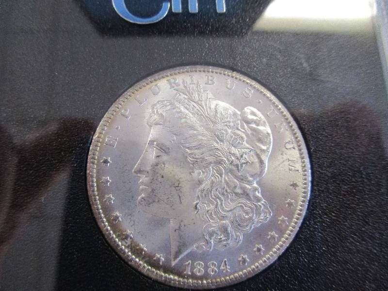 1884 CC (Carson City, NV) Morgan Silver Dollar in Original Government Box with COA.  The Carson City Mint was in existence for 24 years and less than 6% of all Morgan Silver Dollars were minted there which make these very desirable for a MSD Collector.