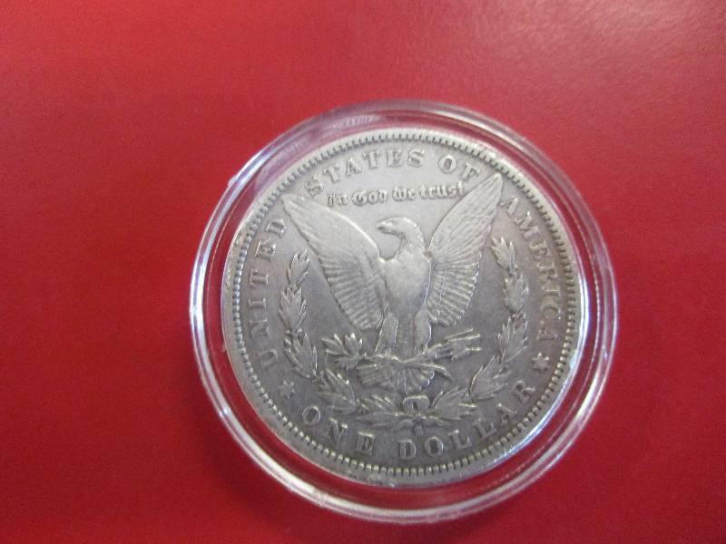 1882-S Morgan Silver Dollar in XF-AU condition in protective capsule. Capsule can be opened for placement in collective folder easily if winning bidder decides.