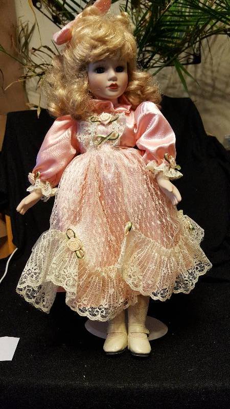 Blonde poreclain doll with pink dress