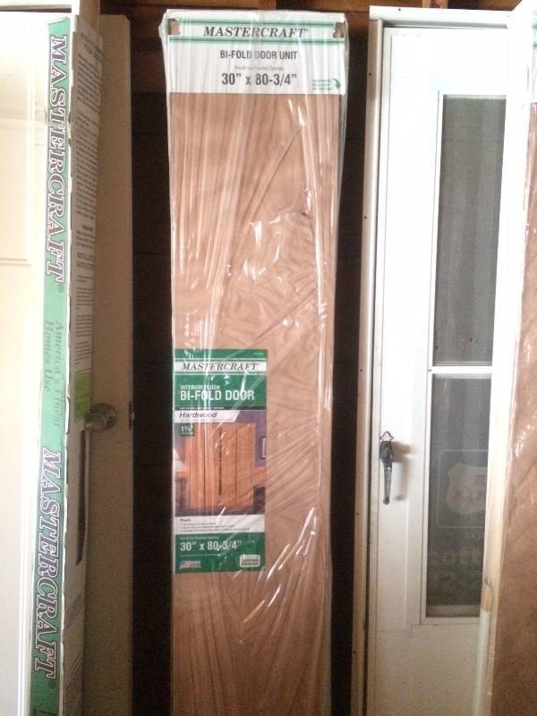 Pair Of Brand New Mastercraft Bi-Fold Doors