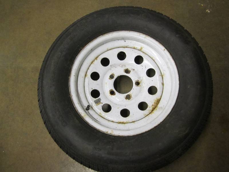 lot 47 image: New trailer tire on rim...