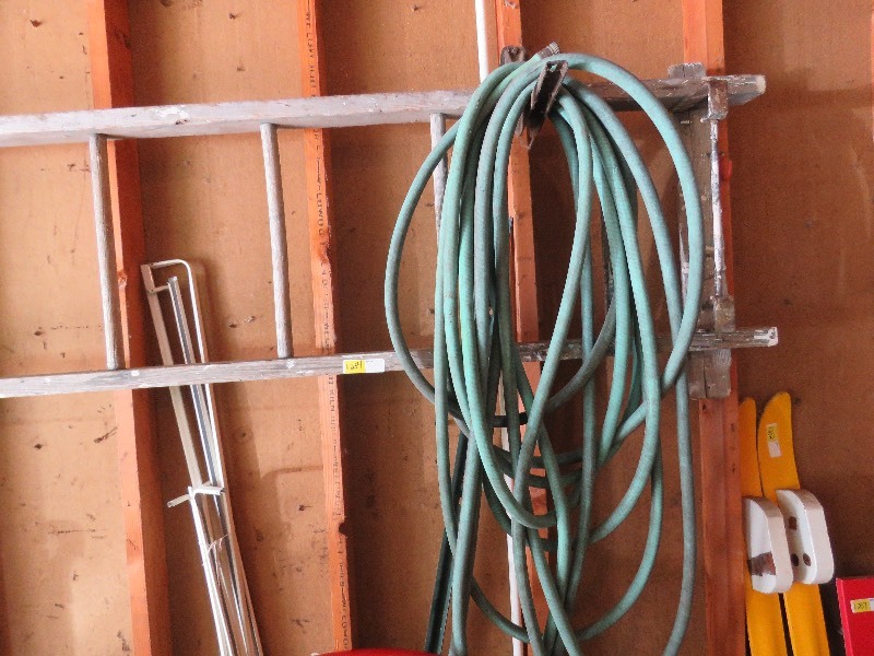 Wood ladder and garden hose
