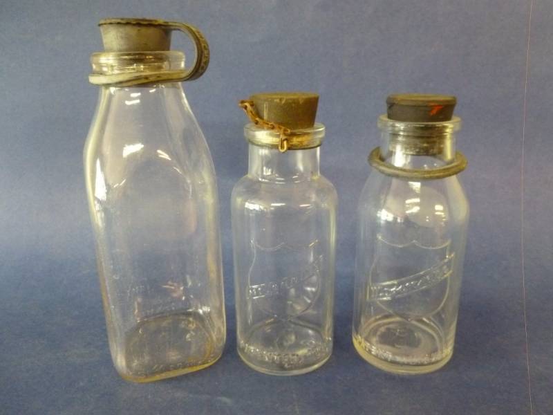 lot 99 image: Antique Milk Bottles