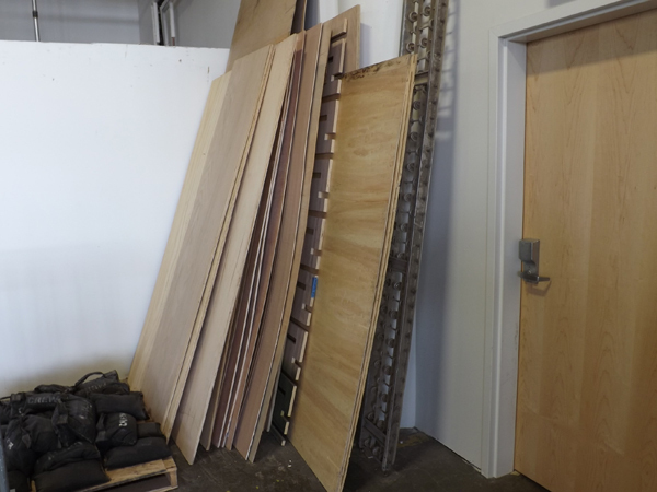 lot 98 image: Large lot of Misc. Plywood Sheets and a 10 Steel Conveyor