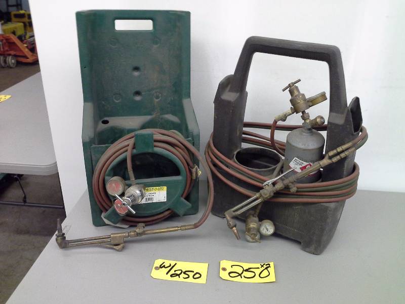lot 250 image: (2) Torch Caddies and Torches