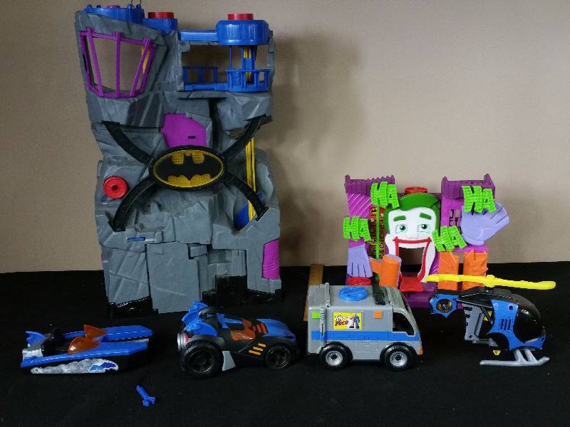 lot 77 image: Fisher Price Batman & Joker Playsets  Vehicles