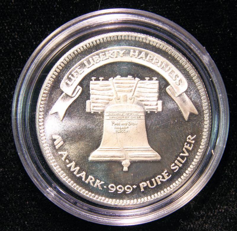 1 TROY OZ. .999 FINE SILVER 1985 A-MARK LIBERTY ROUND IN AIRTITE HOLDER