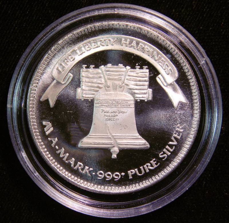 1 TROY OZ. .999 FINE SILVER 1985 A-MARK LIBERTY ROUND IN AIRTITE HOLDER