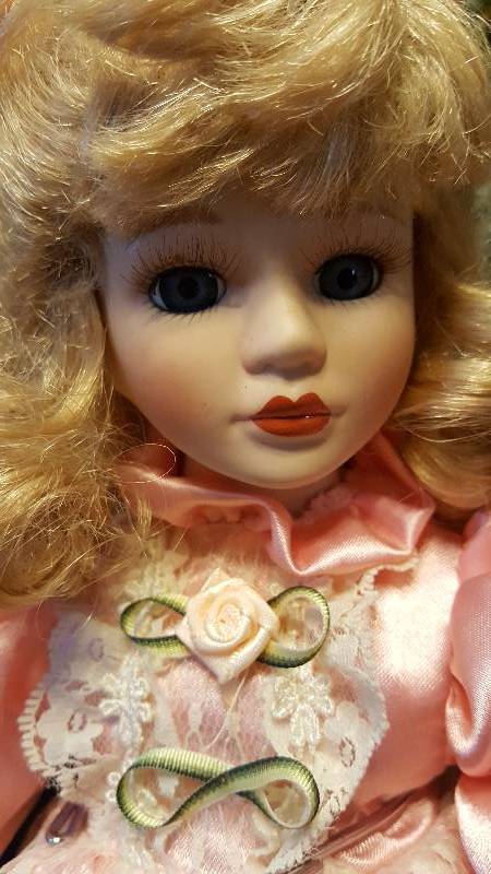 Lot of two Blonde poreclain doll one with pink dress, one with blue checkered dress