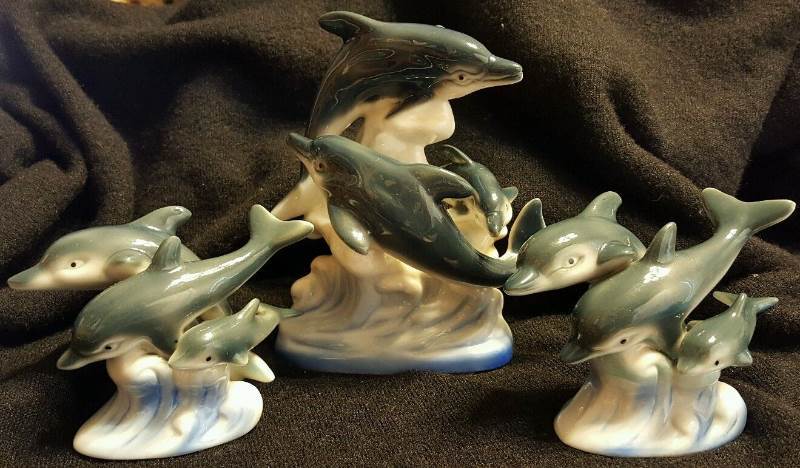 Set of three dolphin ceramic figurines