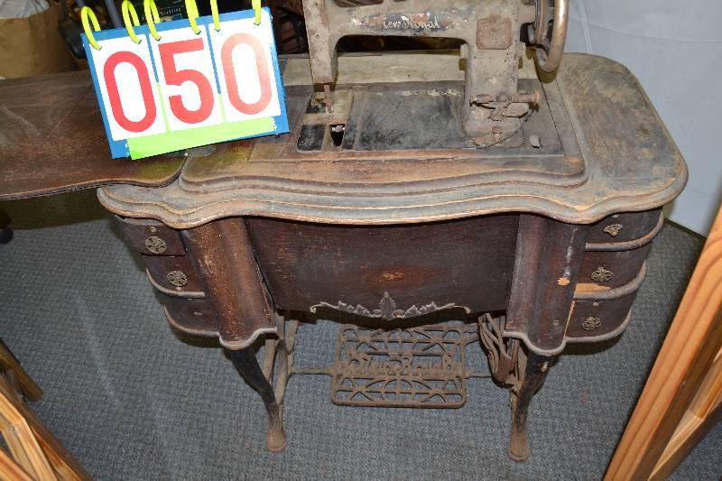 lot 50 image: Antique sewing machine and table