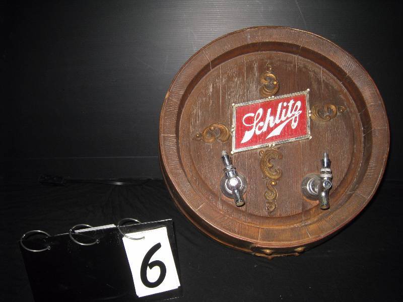 lot 6 image: Rare Schlitz barrel head with tappers, wall mounted, foam barrel, metal tappers