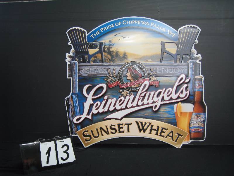 lot 13 image: Leinenkugels Sunset Wheat tin sign, nice lakeside image - perfect for the cabin