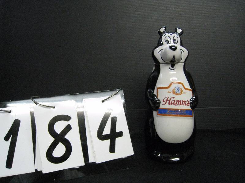 lot 184 image: Hamms Beer bear decanter - unopened  still contains beer from 1972