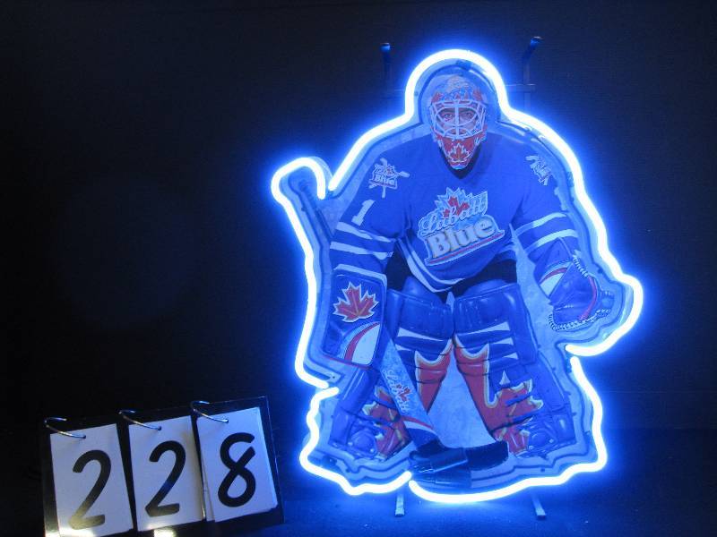 lot 228 image: Labatt Blue hockey goalie tin tacker with neon NEW