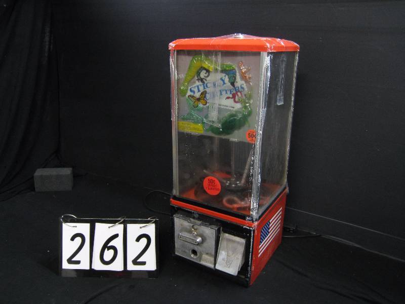lot 262 image: Gumball machine - made to dispense toys, seller states functional needs top lock and coin lock