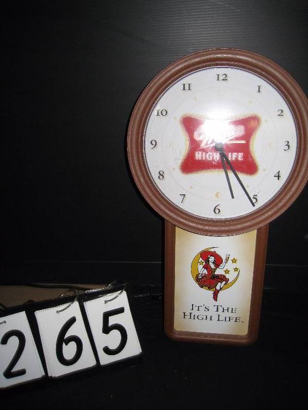 lot 265 image: Miller High Life clock, girl on the moon, battery powered