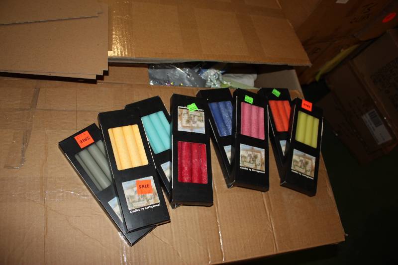 lot 42 image: 10 Tapered Candles Boxes of 4  assorted     Quantity 102 boxes of 4.