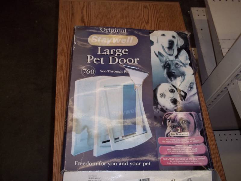 lot 43 image: Large pet door, frame and solid door only