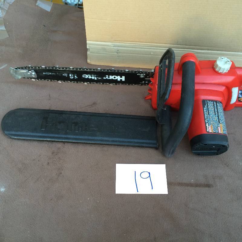 lot 19 image: Homelite 16 in. 12-Amp Electric Chainsaw in like New working conditions Model # UT43122B