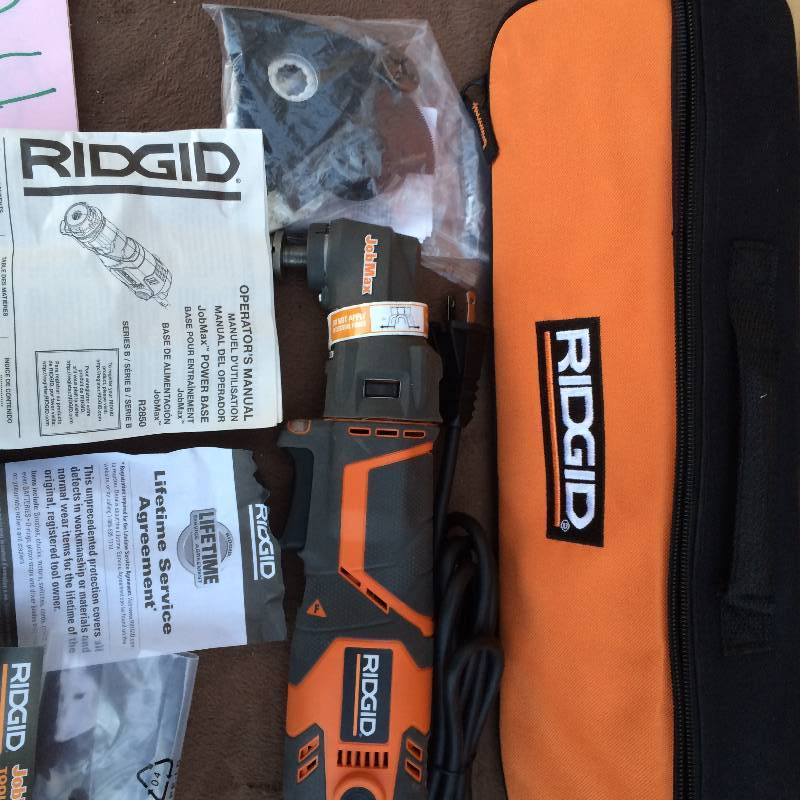 lot 24 image: Ridgid JobMax 3 Amp Multi Tool Starter Kit Model # R28600 in like New conditions