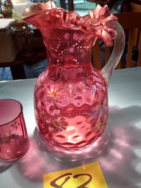 Cranberry Pitcher and one glass with floral design. Very old