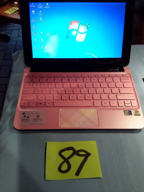 Mini Computer.. Pink Plaid.. H.P. M ini.. 210-1199 DX.. 217 GB Hard Drive, 1 Gig Ram. Windows 7.. Has charger and case. .Works.