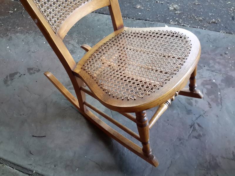 Wicker Rocker.. Cane is in excellent condition.. Oak Wood 80 years old.