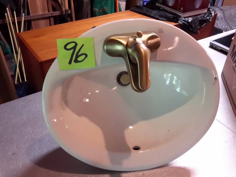 Bathroom Sink. Almond Color with Brass sink leaf light.. Purchased at creative lighting.