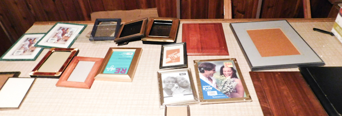 lot of misc smaller frames and wooden plaques