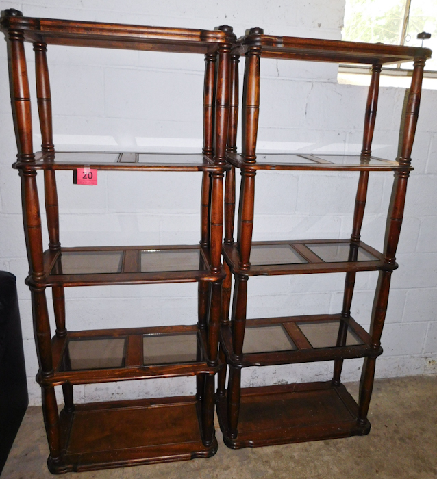 Two wood and glass shelving units