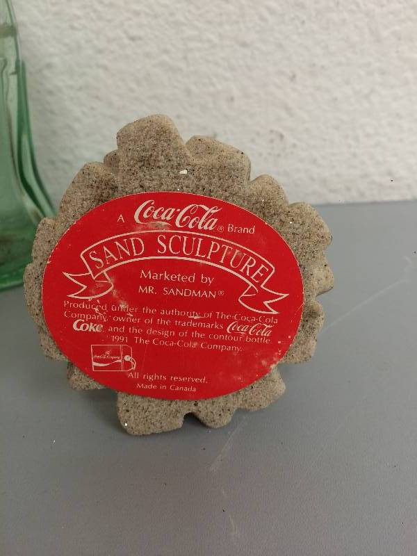 lot 39 image: Coca-Cola Bottles and Sand Sculpture