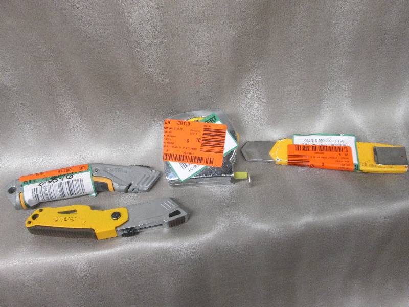 lot 98 image: Utility knives, 25 ft tape measure...