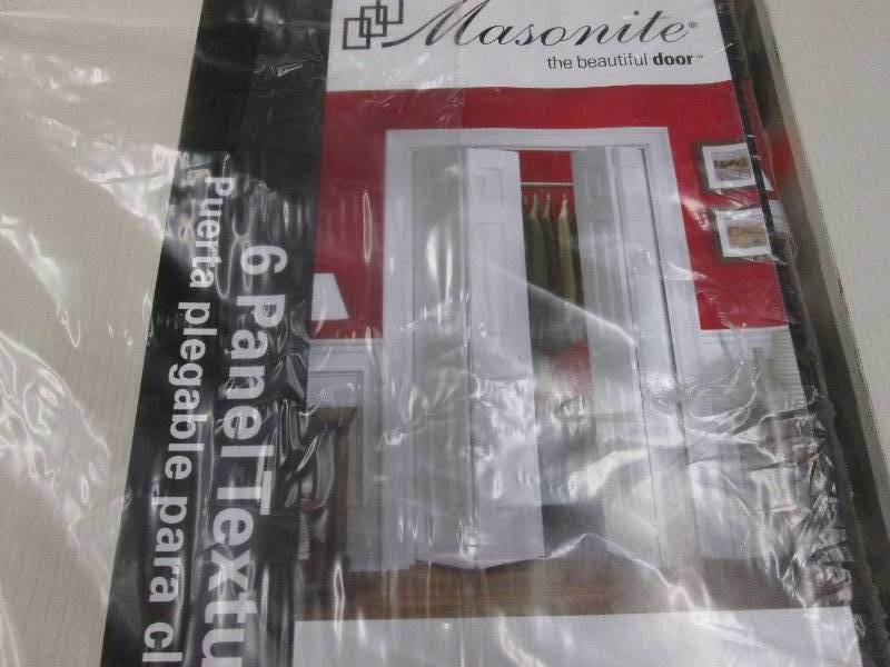 lot 165 image: Masonite 24 in x 80 in bifold close...
