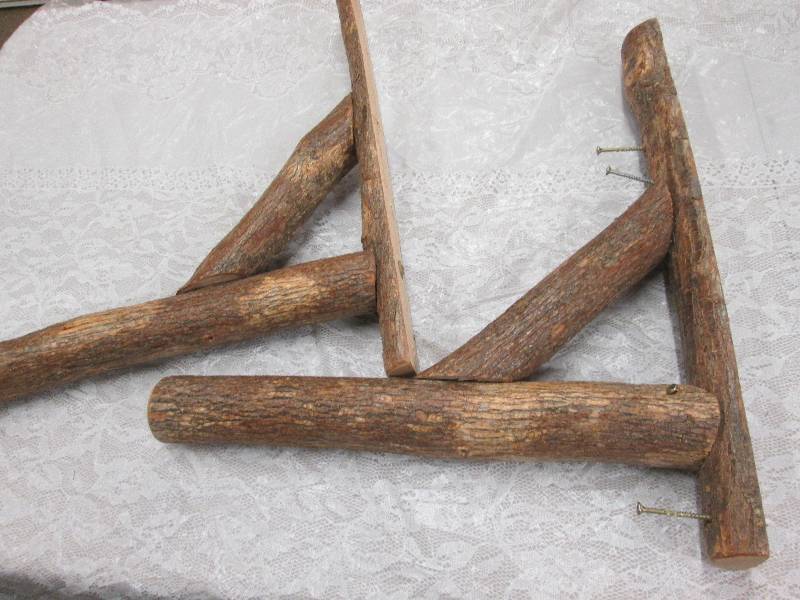 lot 336 image: Rough hewn wood shelf brackets...