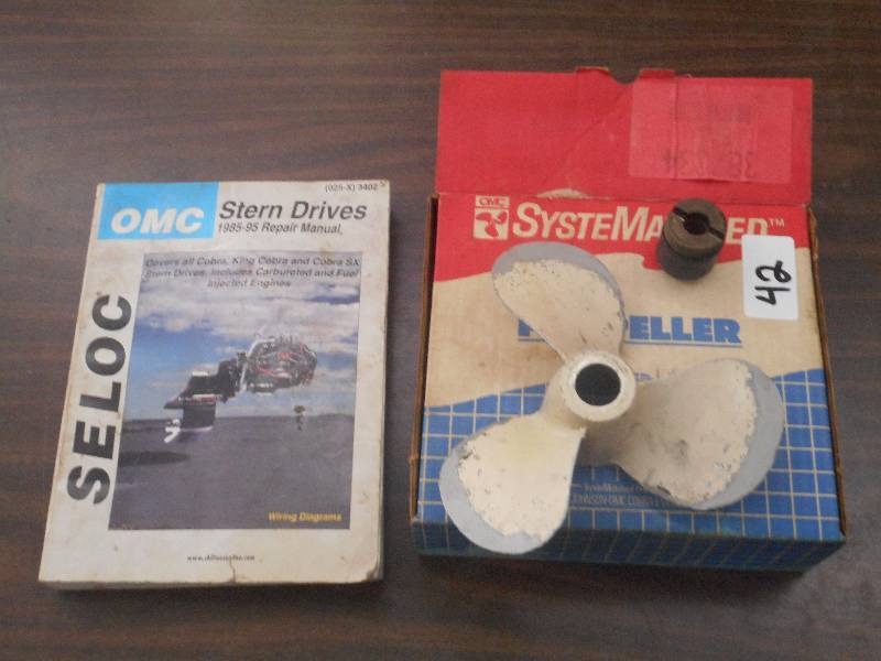 lot 42 image: (1) Used Motor Prop & (1) OMC Repai...