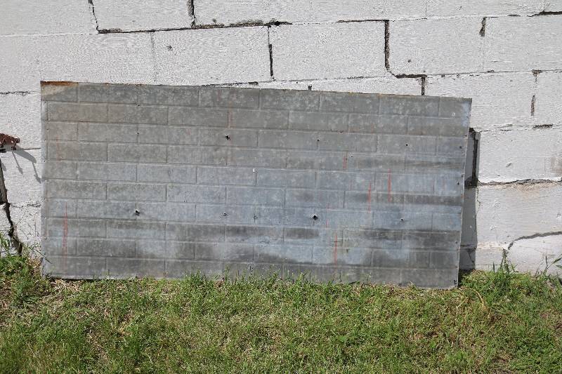 Tin with brick inprint
