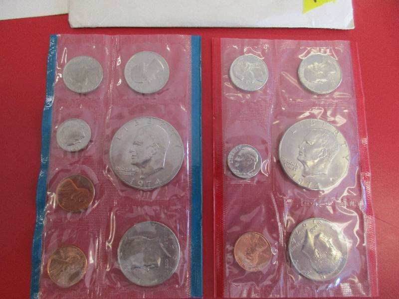 1974 Philadelphia and Denver US Mint Sets.  Eisenhower Silver Dollar, Kennedy Half Dollar, Washing ton Quarter, Jefferson Nickel, Roosevelt Dime and Lincoln Pennies including the 1974-S Penny.